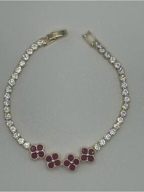 Gold Tone Tennis Bracelet with Ruby-Red Clovers